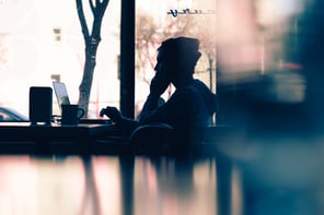 Woman working from a cafe